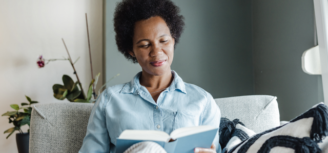 woman reading on a couch